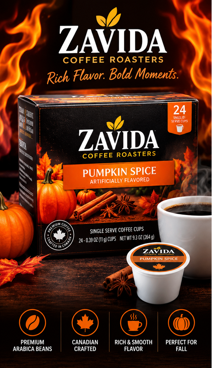 Zavida Coffee Roasters Pumpkin Spice single-serve coffee cups shown with the retail box, a brewed cup of coffee, cinnamon sticks, pumpkins, and autumn leaves on a dark rustic background with flame graphics. The box reads 'Pumpkin Spice Artificially Flavored' and 'Single Serve Coffee Cups.